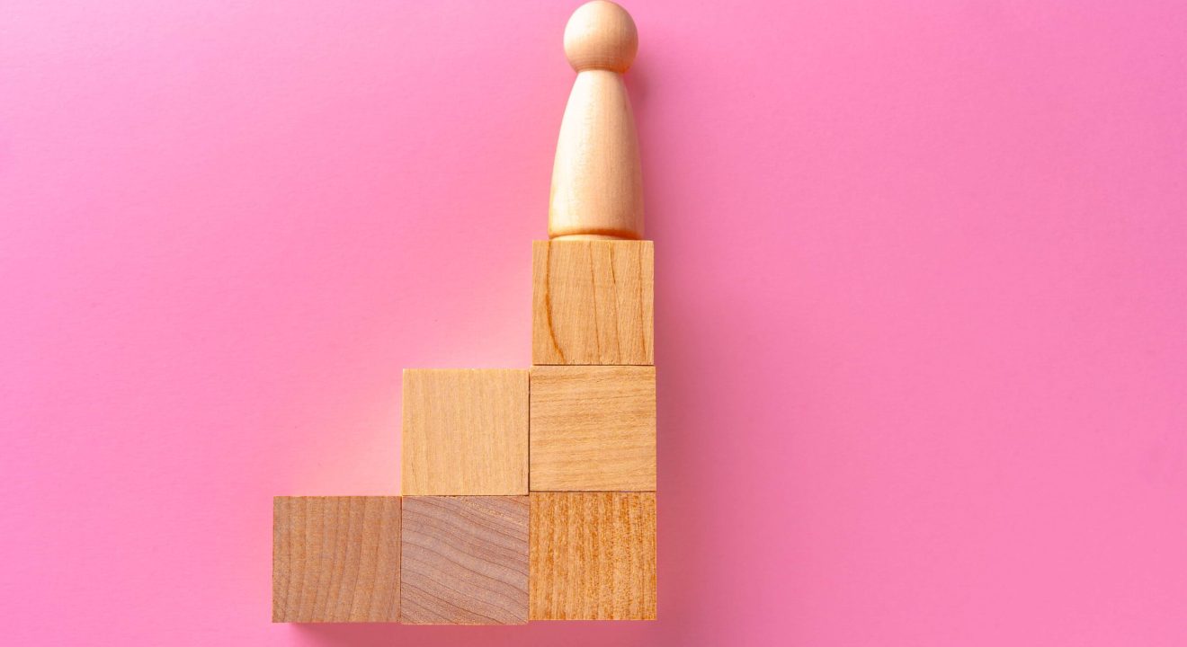 top-view-of-toy-wooden-blocks-on-pink-2023-11-27-05-09-18-utc-min